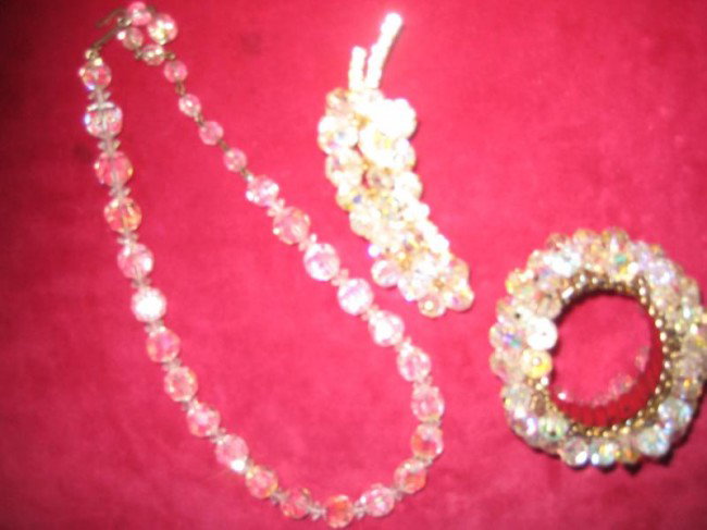 Signed Laguna crystal necklace along with a crystal: Signed Laguna crystal necklace along with a crystal broach and crystal expandable bracelet - (est. value $40 -$50)