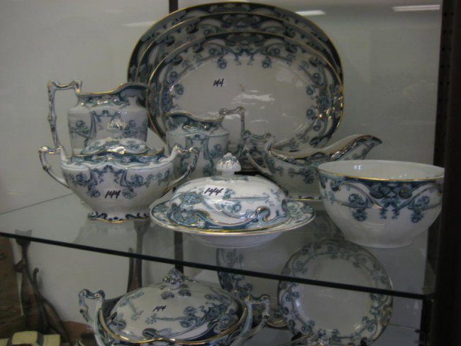 Group of Royal Staffordshire Pottery made in Bursl: Group of Royal Staffordshire Pottery made in Burslem, England in the Iris pattern to include: 3 graduated platters, crème pitcher, creamer and sugar, covered buttter, gravy boat with under plate, lar