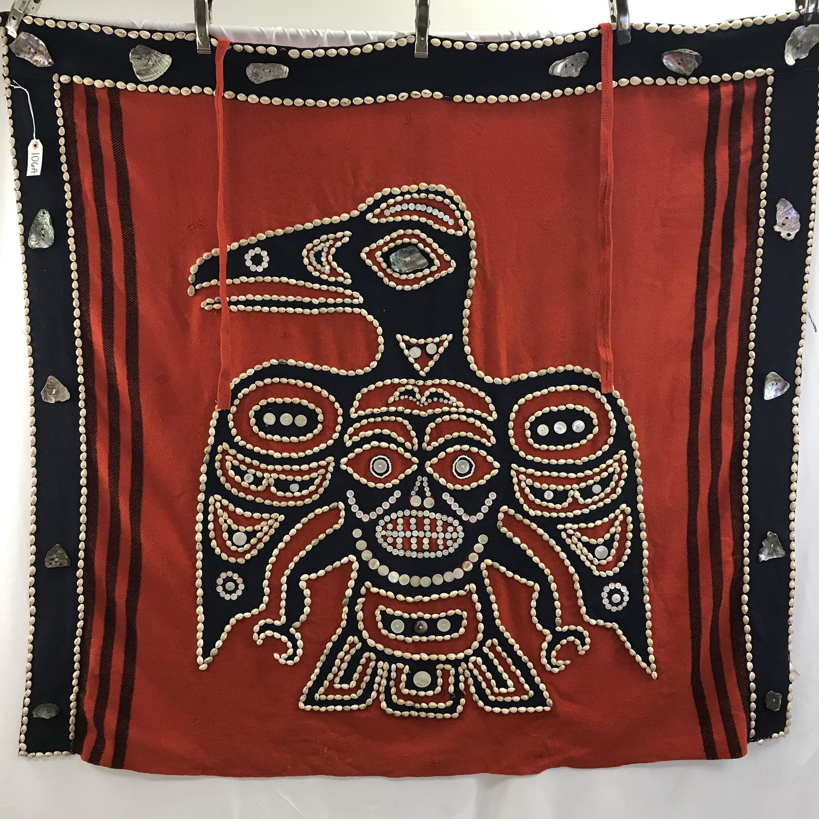 19th C. Hieltsuk Chief's Robe with Thunderbird and: Outstanding 19th century Heiltsuk chief's robe with Thunderbird appliquÃ© and bordered in cowrie shells, buttons, and abalone with sweaty bead eyelets depicting a thunderbird with face. The Heiltsuk