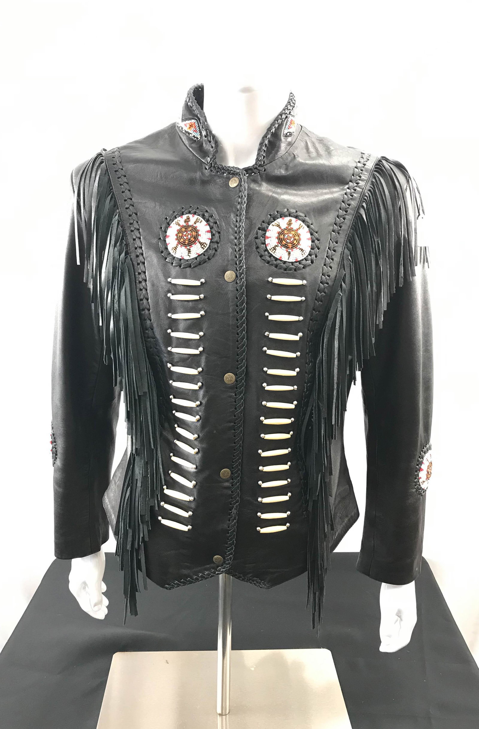 Beaded Lamb Leather Fringe Jacket: This lambskin leather fringed jacket has beaded Native American turtle design medallions on the chest, back and sleeve. There is also beading on the collar. It is by 3B-West and is XXL.