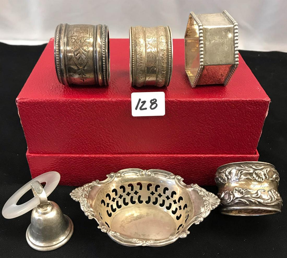 Victorian Group of Sterling Napkin Rings, More: This group of turn of the century sterling silver includes 4 ornately chased napkin rings, along with a bell with a mother of pearl ring, and a small reticulated oval basket. They weigh 100 grams.