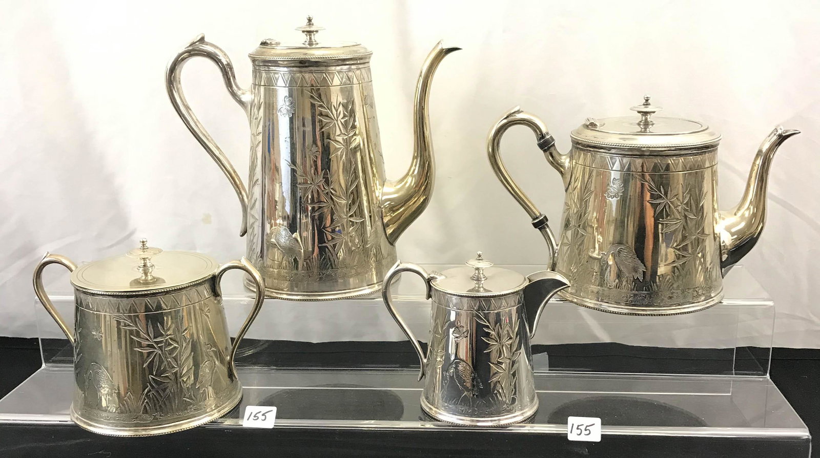 1800's Oriental Design English Coffee/Tea Set: This English 1800's ornate 4 piece coffee/tea set includes a coffee pot (8.5" tall X 9" across), a teapot (6.5" tall X 9" across), a covered sugar pot (5" tall X 7.5" across), and a lidded creamer (5"