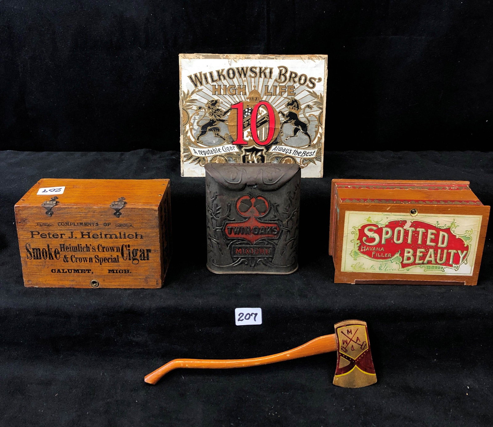 Advertising Cigar Boxes and More: This lot includes a Twin Oaks cigar tin, miniature cigar box for Spotted Beauty Havana Cigars and match box for Heimlich's Crown Cigars of Calumet Michigan. Also included are folk are wooden hand carv