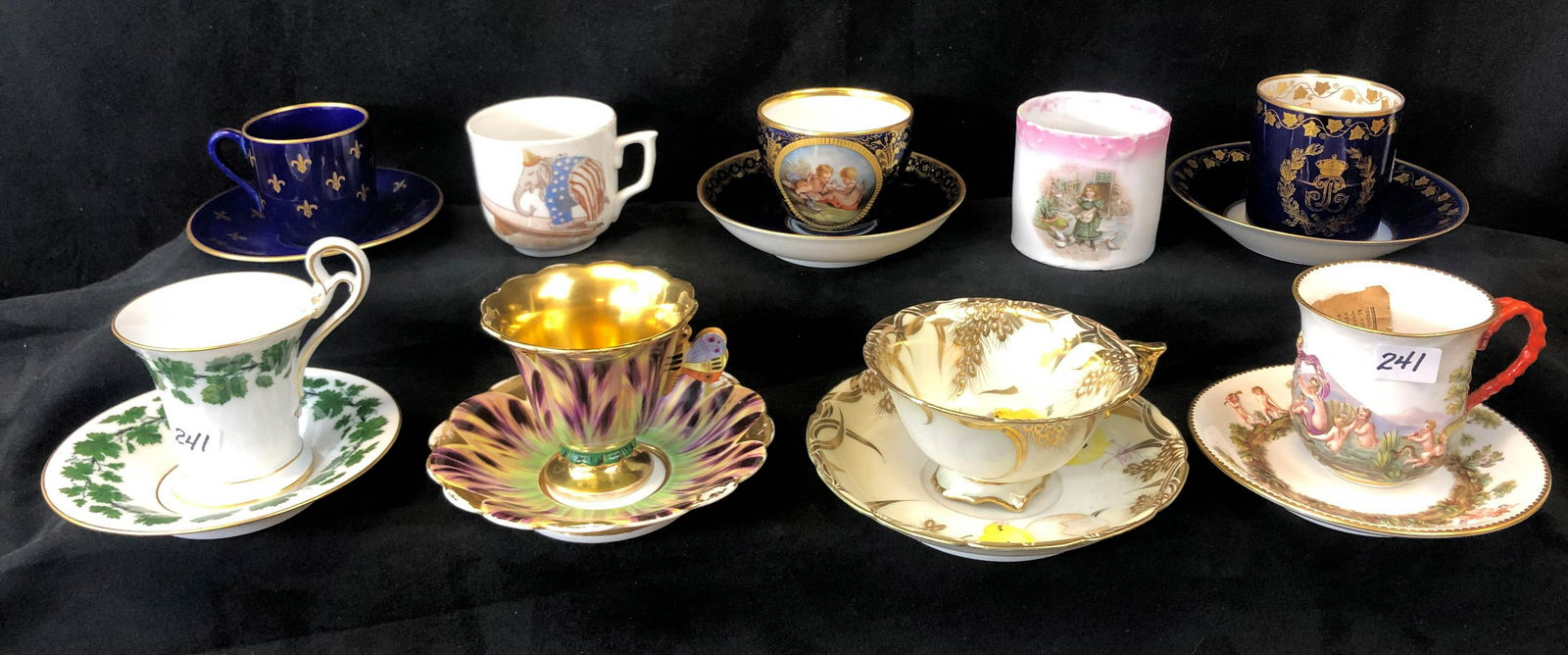 Seven High Quality Cups and Saucers with 2 Additional: This lot includes a cobalt and gold trim cup and saucer with royal monogram signed Sevres and other markings in excellent condition. Cobalt and gold fleur de lis cup and saucer marked Rorstrand, anoth