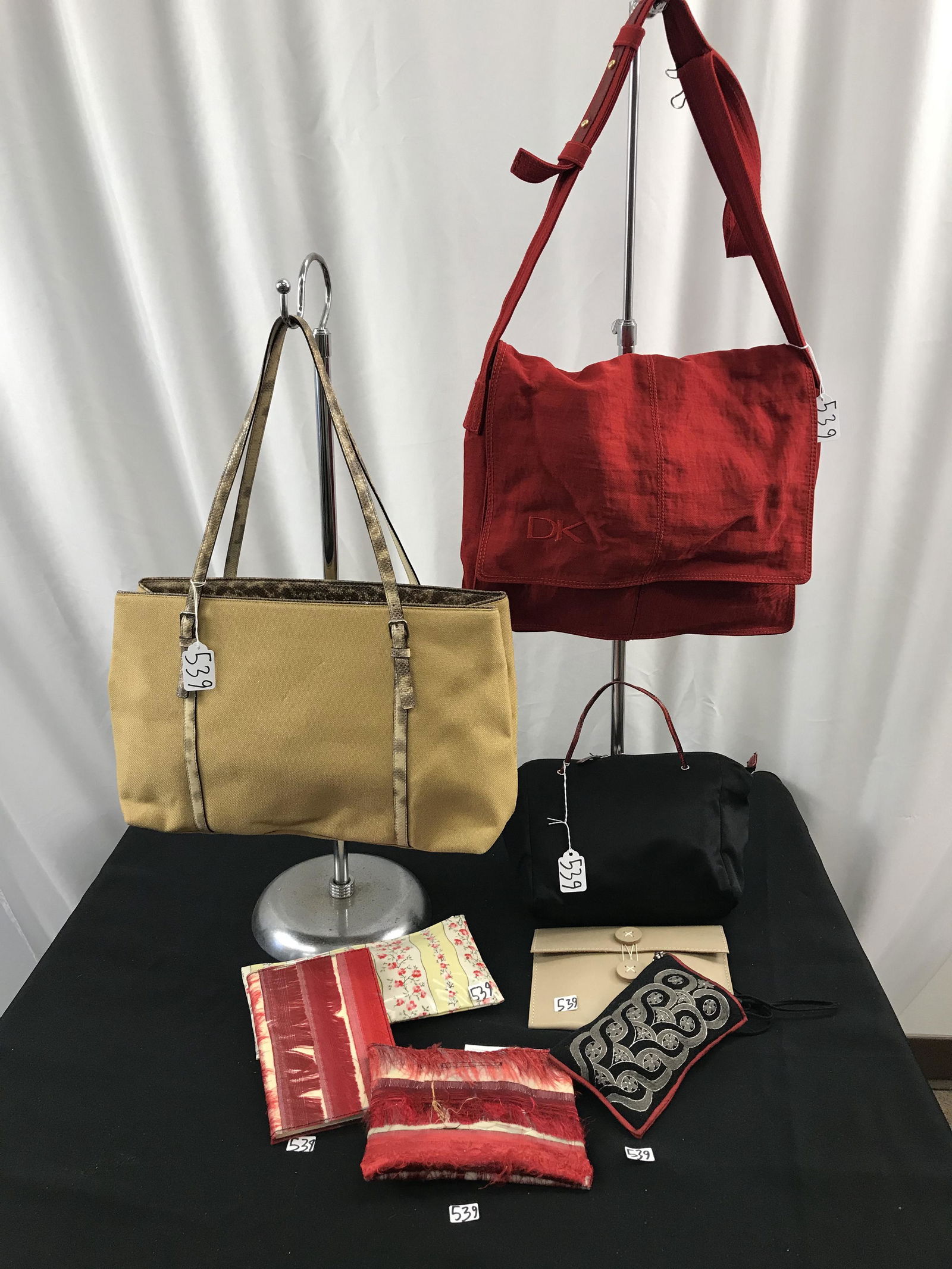 Group of Designer Bags, Tardini, Donna Karan: This group of designer bags includes a snake skin and tan canvas double handled purse by Tardini in excellent condition (10" tall X 18" across), a black satin Tardini bag with red snake piping (8" tal