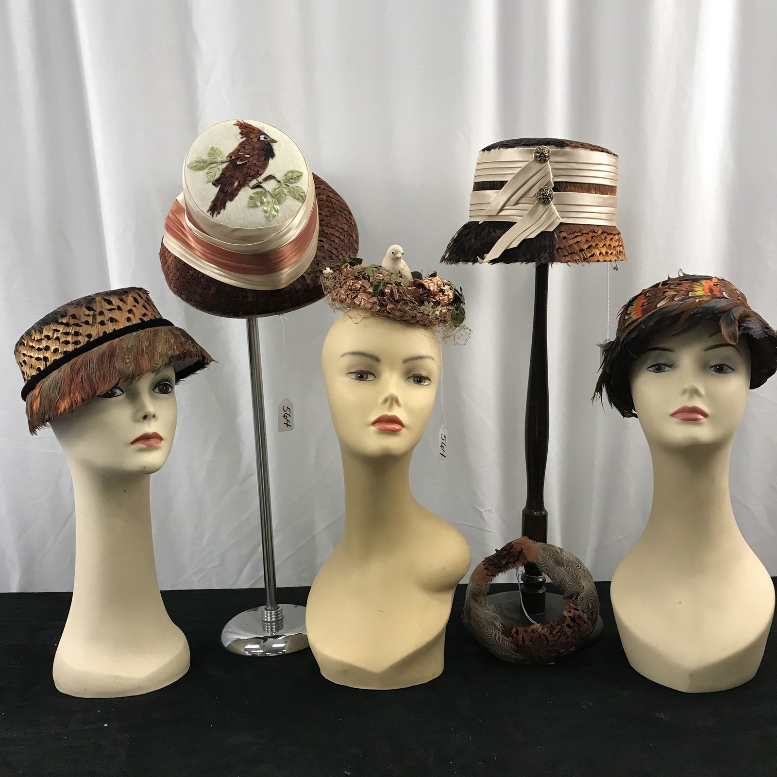 Group of 1950's Feathered Hats: This group of 50's and 1960's vintage feathered hats include 3 bucket style hats with pheasant feathers (2 designed and handmade by Mildred Wiltgen), one bucket hat with a cardinal on the top, a 50's