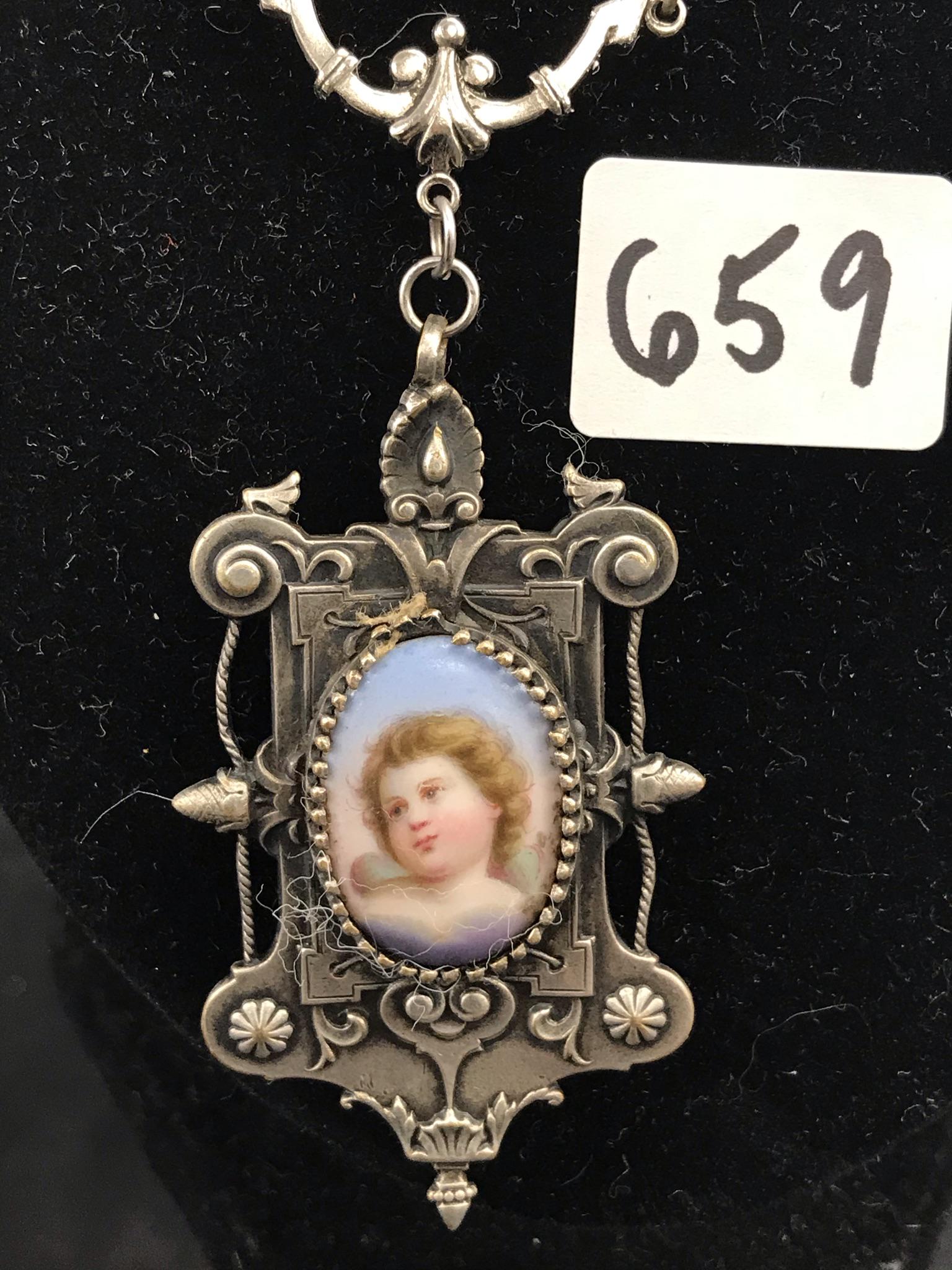 Victorian Sterling Miniature Portrait Pendant: This early Victorian Sterling silver miniature portrait momento mori pendant has an oval enamel portait of a young child on the front, and a glass front reliquary locket on the reverse for a lock of h
