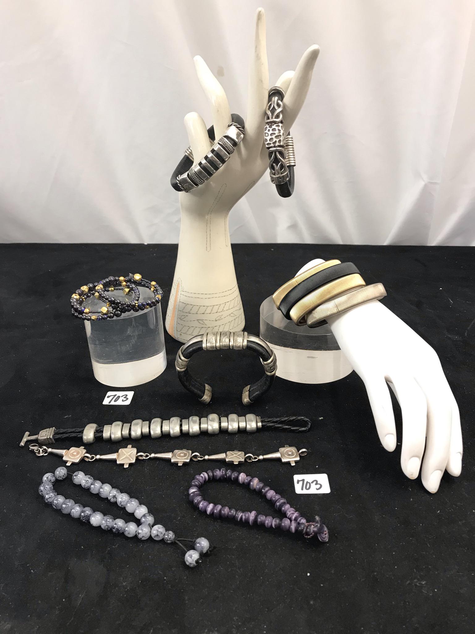 Group of Quality Ladies Bracelets, Sterling, Gold: This group of quality ladies bracelets include a sterling silver link bracelet (it weighs 36 grams), 2 coil bracelets with real 14K gold beads, 2 stone bead bracelets, a braided leather and metal link
