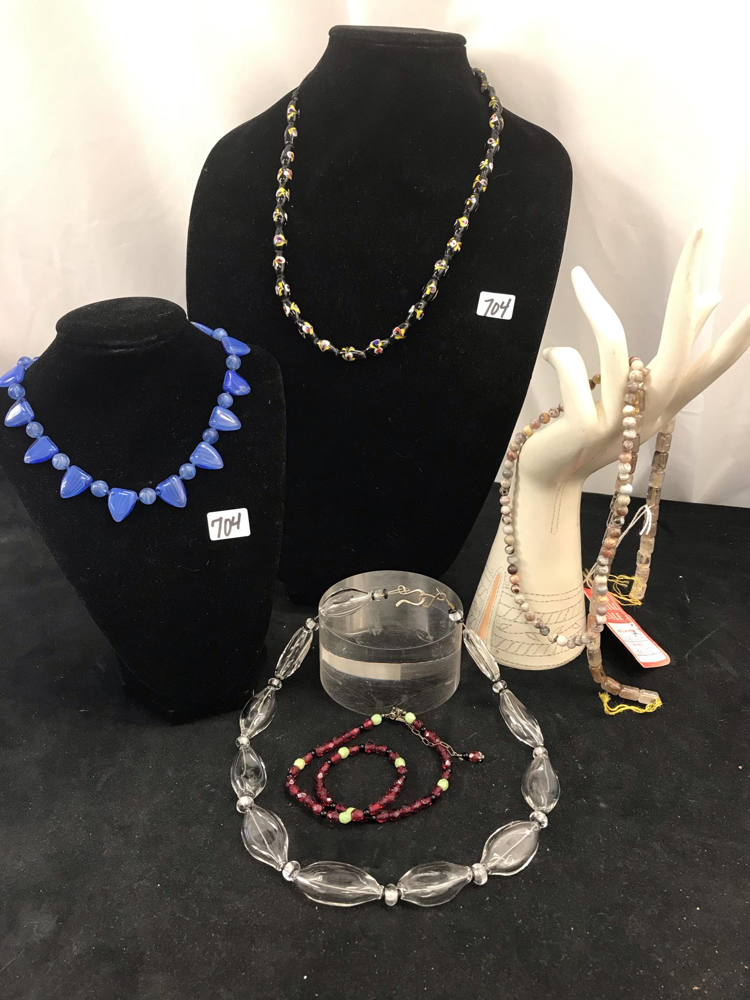 Group of Quality Ladies Necklaces, Beads: This group of quality ladies bracelets and strung beads include a strand of Murano glass beads in black with colors mixed in, a 1930's blue Murano glass necklace (31" long), a strand of clear hand blo
