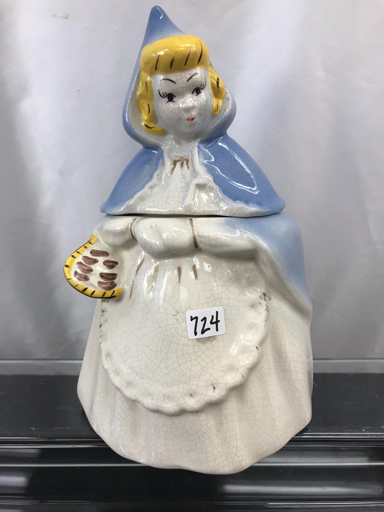 Rare McCoy Little Red Riding Hood Cookie Jar: This rare 1940's McCoy Little Red Riding Hood Cookie Jar is in a blue cape and carrying a goodie basket. There are no chips or cracks. There is some crazing to the glaze. It measures 11" tall X 7" acr