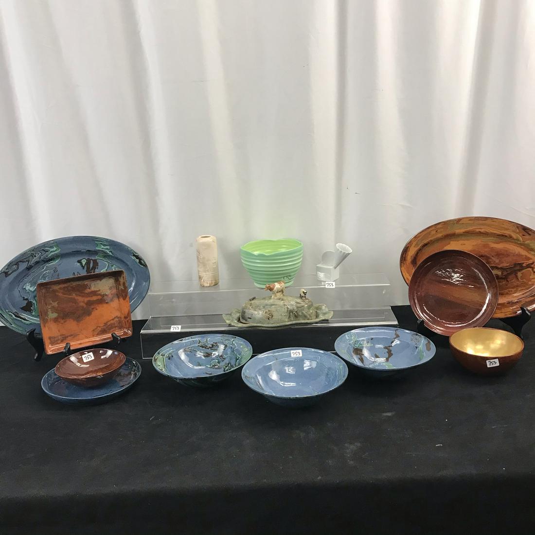 Group of Art Pottery and Ceramics: This group of art pottery and ceramics include a signed butter dish with a cow and sheep on it, a green hand thrown bowl signed M E, a group of 10 pieces of a marbleized finish signed pottery, a small