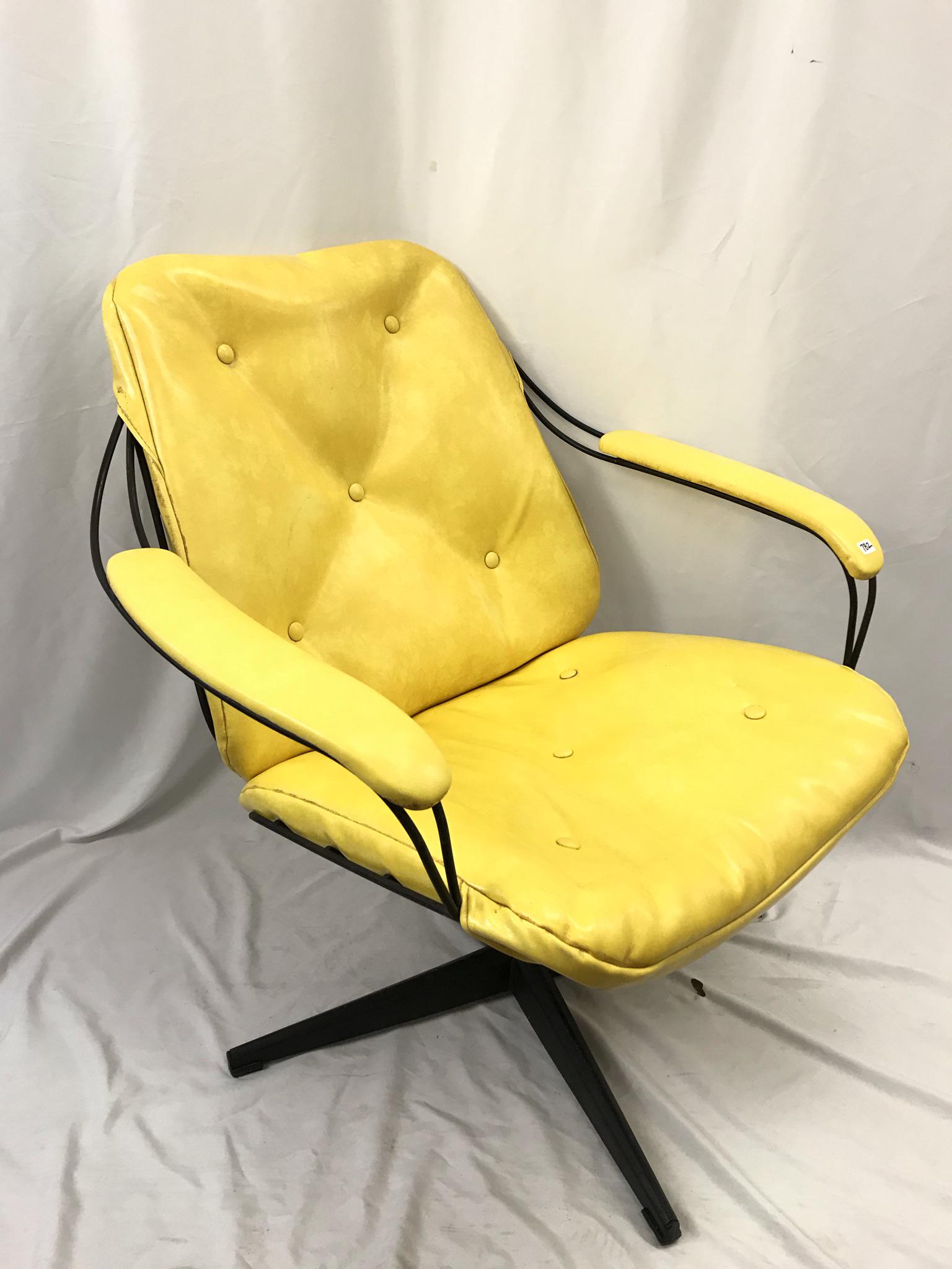 MCM Homecrest Wire Swiveling Chair: This Mid Century black wire based swiveling armchair is by Homecrest Industries, and sports 2 chrome yellow removable cushions that have zippers. It measure 32" tall X 30" across X 21" deep.