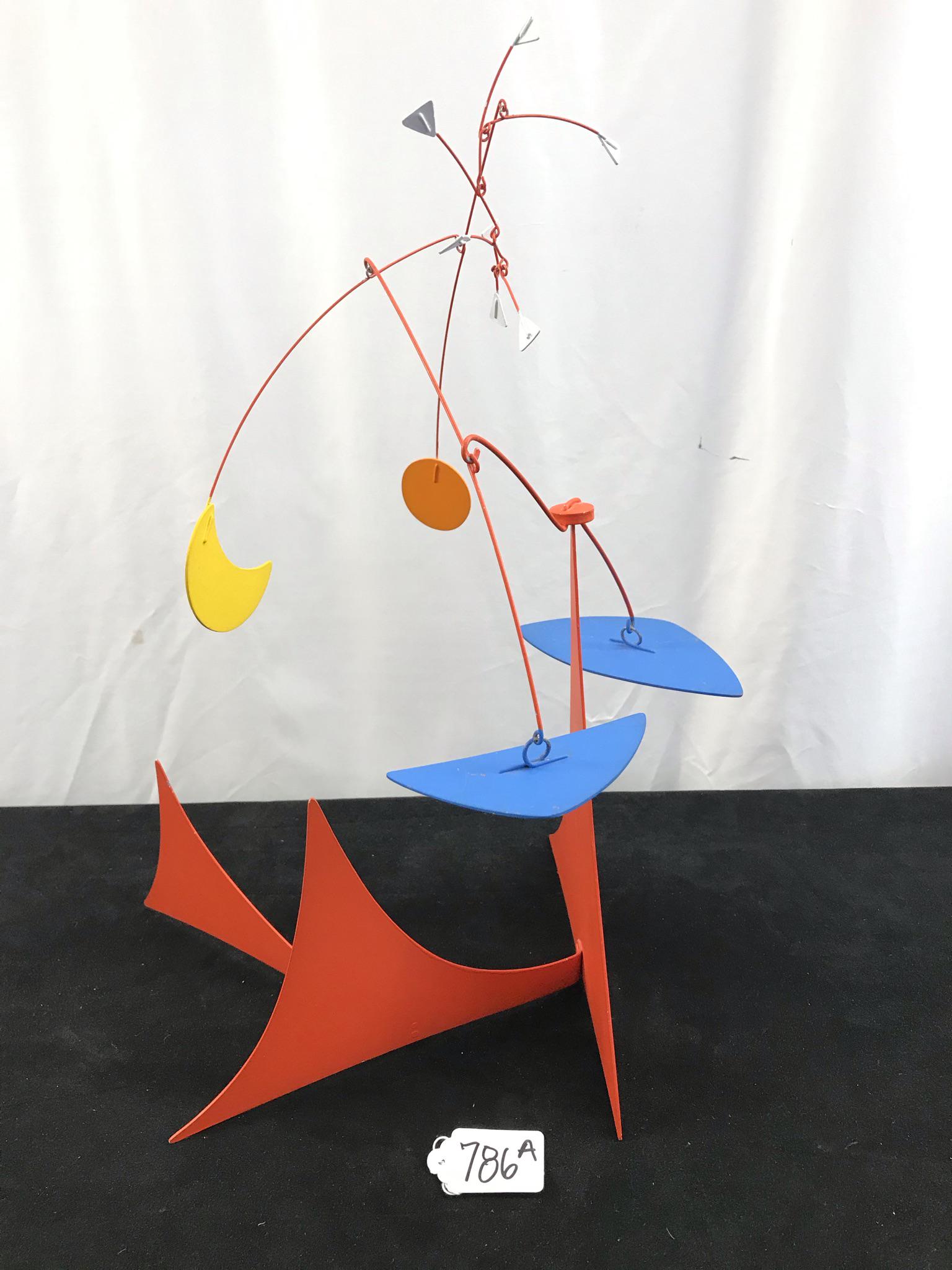 Arthur Bauman Kinetic Moblile Sculpture: This 1970's kinetic mobile sculpture is by listed artist Arthur Bauman and in the style of Alexander Calder. It has a planetary theme with the sun, moon and stars in primary red, blue, yellow, and whi