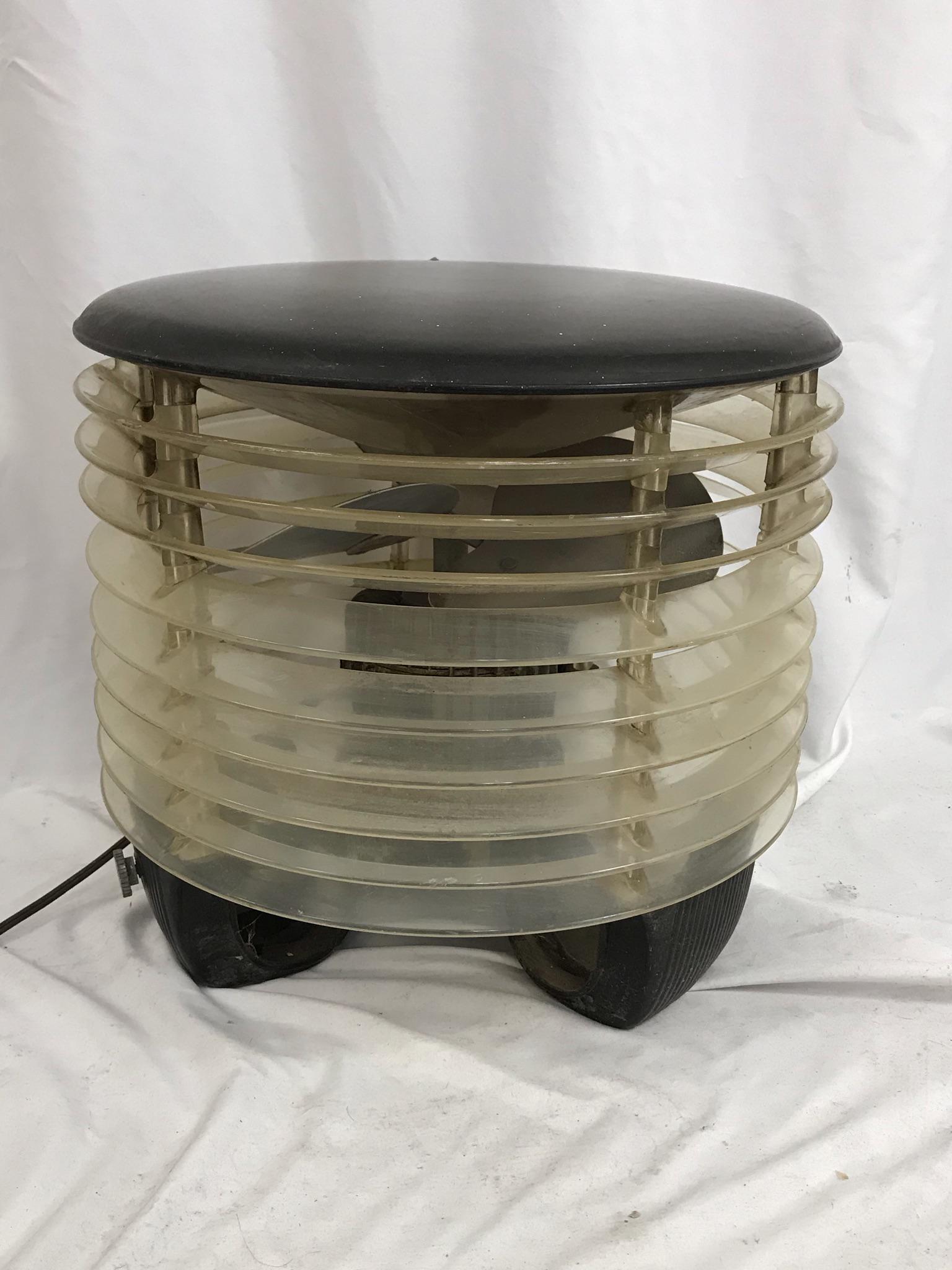 1940's Lamb Electric CO. Floor Stand Fan: This 1940's Lucite and metal Lamb Electric Company round floor model fan is in excellent working condition. It measures 14.5" tall X 14.5" across.