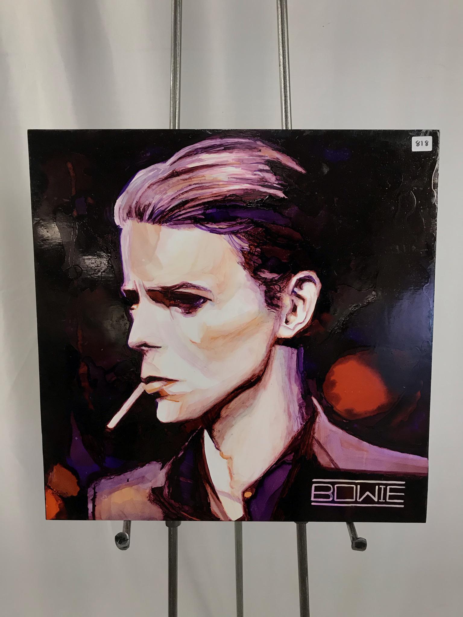 David Bowie Acrylic on Board Painting: This contemporary acrylic on board, unsigned, depicts famous rock singer David Bowie smoking a cigarette. In excellent condition, this remarkable portrait measures 18" tall X 18" across.