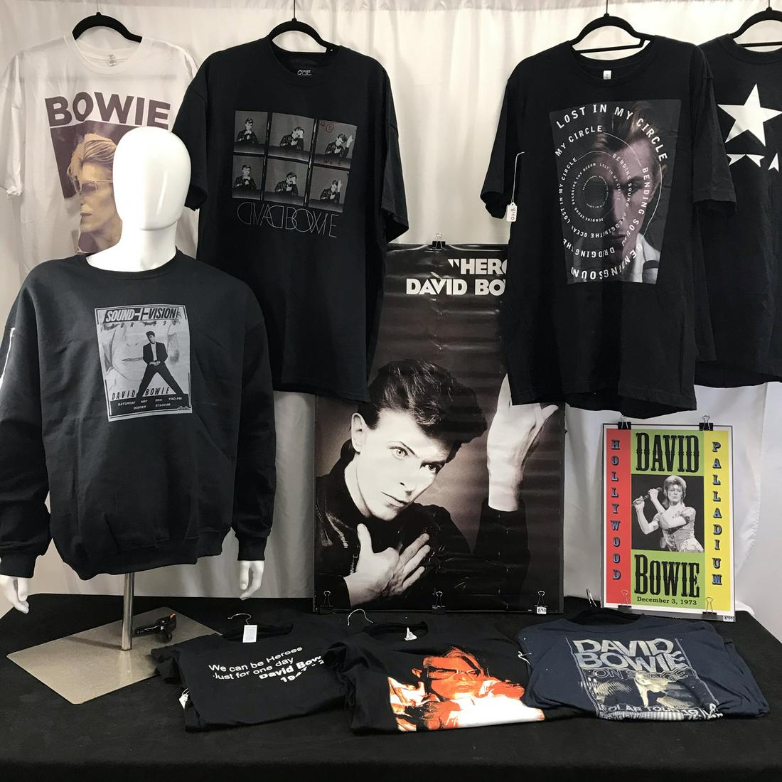 Large Group of David Bowie T Shirts: Tis large group of David Bowie Concert T's include an unworn long sleeve black sweatshirt with Sound and Vision Graphics (2XL), a black Bowie film test strip of photos for the Heroes album, a black un