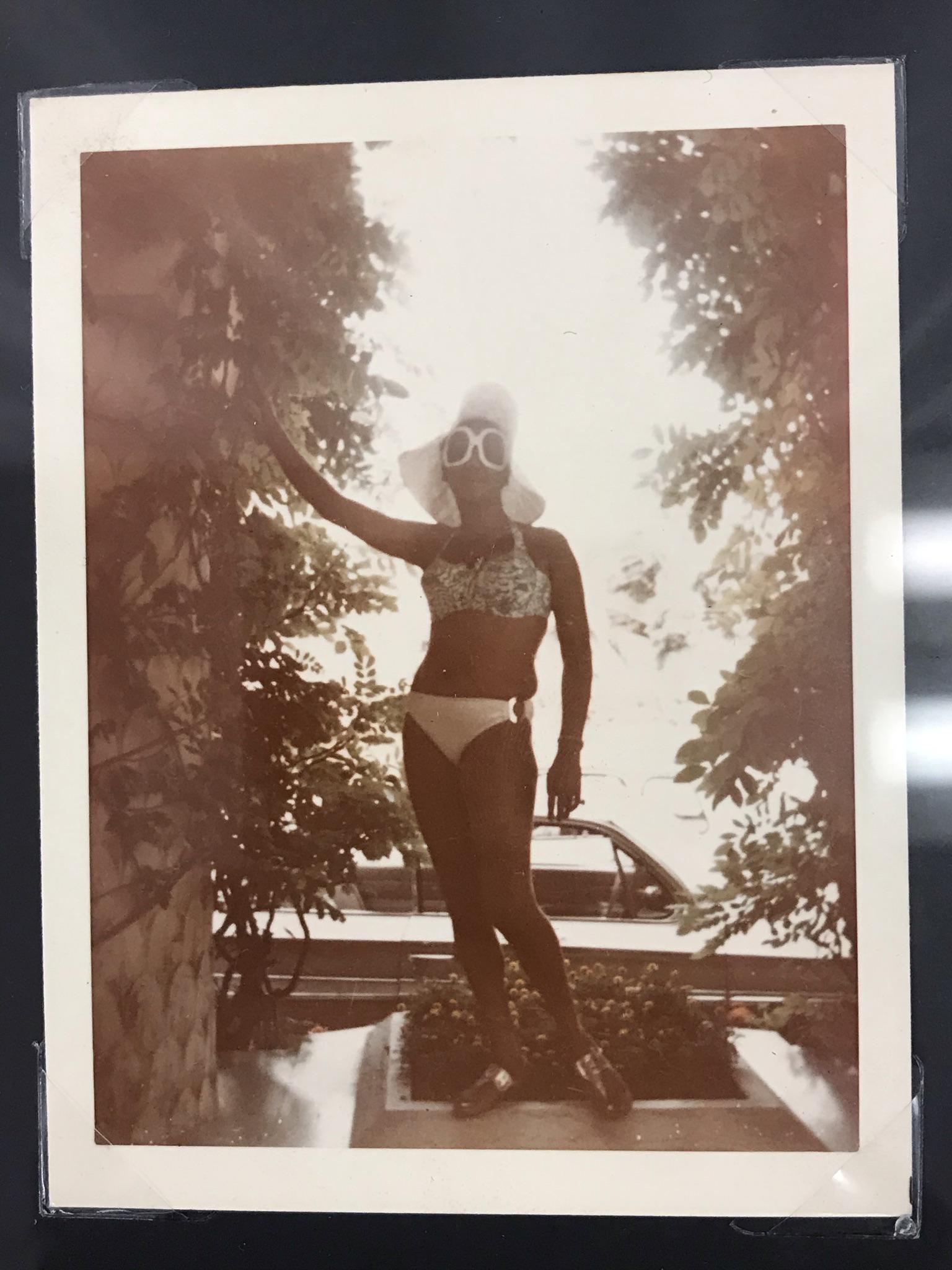 Aretha Franklin Personal Photograph: This original 1970's Aretha Franklin personal snapshot photograph shows Aretha in a bikini and wearing outrageously sized sunglasses and floppy hat. It measures 4.25" tall X 3.25" across. This photogr