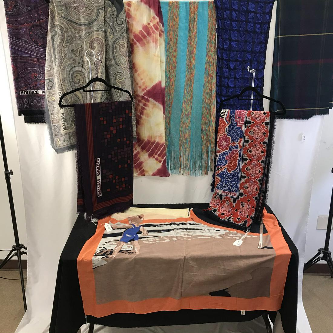 Designer scarves, Missoni, Andrea Pfister More: This group of designer scarves include a mulit colored mesh finged Missoni (78" long X 18" across), 4 Andrea Pfister scarves to include 2 apiley scarves, one with a geometric print, and one with a red