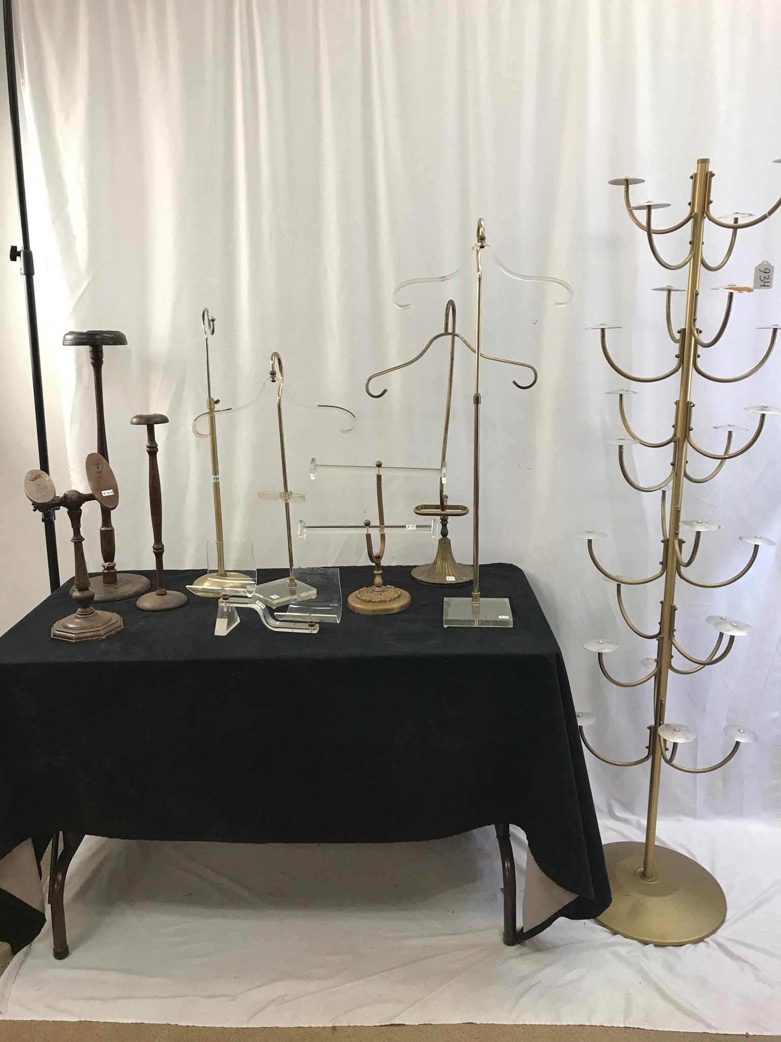 Vintage Clothing Store Display Items: This group of vintage store clothing display items include a 1950's hat rack to display 24 hats, a 1930's wooden shoe display, 2 1920's wooden hat displays, a height adjustable 1940's table top garmen