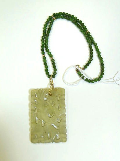 Green jade necklace with 10K gold balls - measures : Green jade necklace with 10K gold balls - measures 16" long, along with a pierced, carved Jade pendant depicting a bird - Est. Value $250 - $300