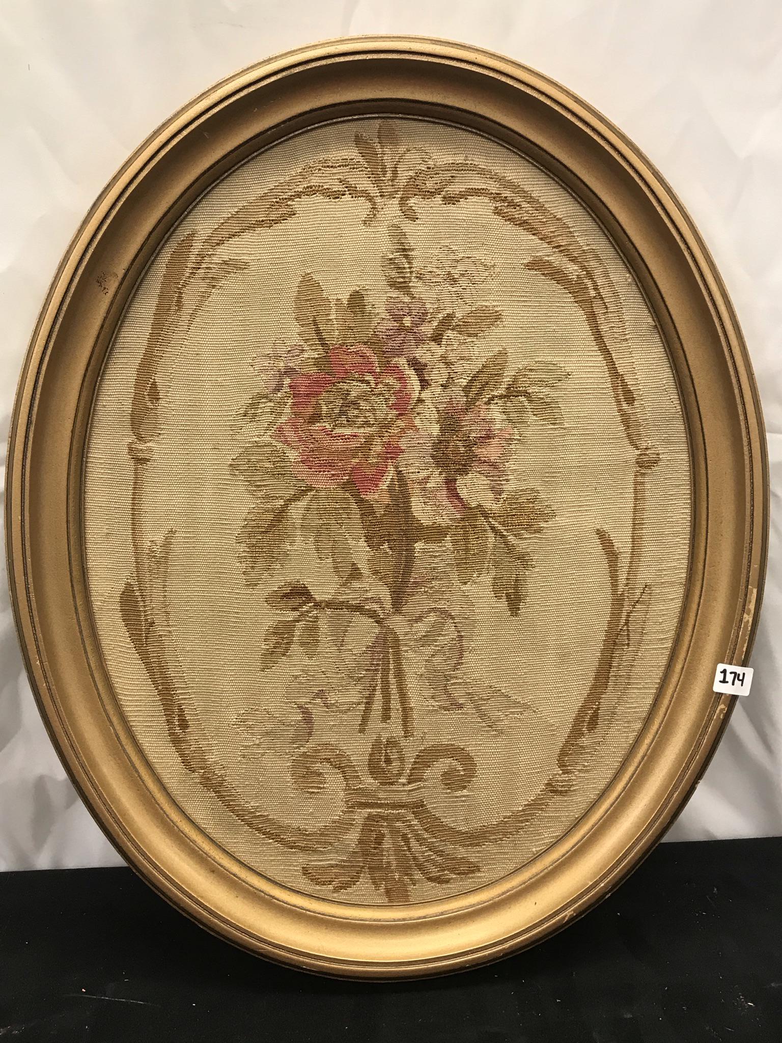 Aubusson Turn-of-the-Century Needlepoint: This turn-of-the-century Aubusson fine needlepoint depicts a bouquet of roses tied with a ribbon and set into an oval frame. It measures 21" tall X 16.75" across.