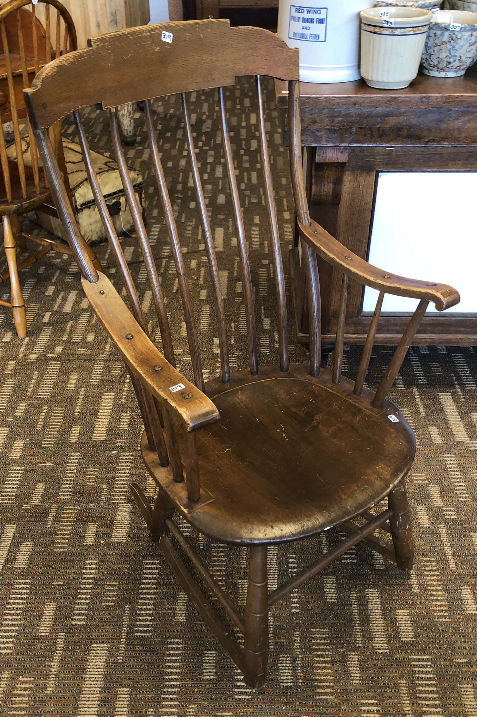 Early Plank Seat Rocker: Early plank seat spindled back rocker in original finish, 1810 - 1820. It measures 39" X 20" X 17".