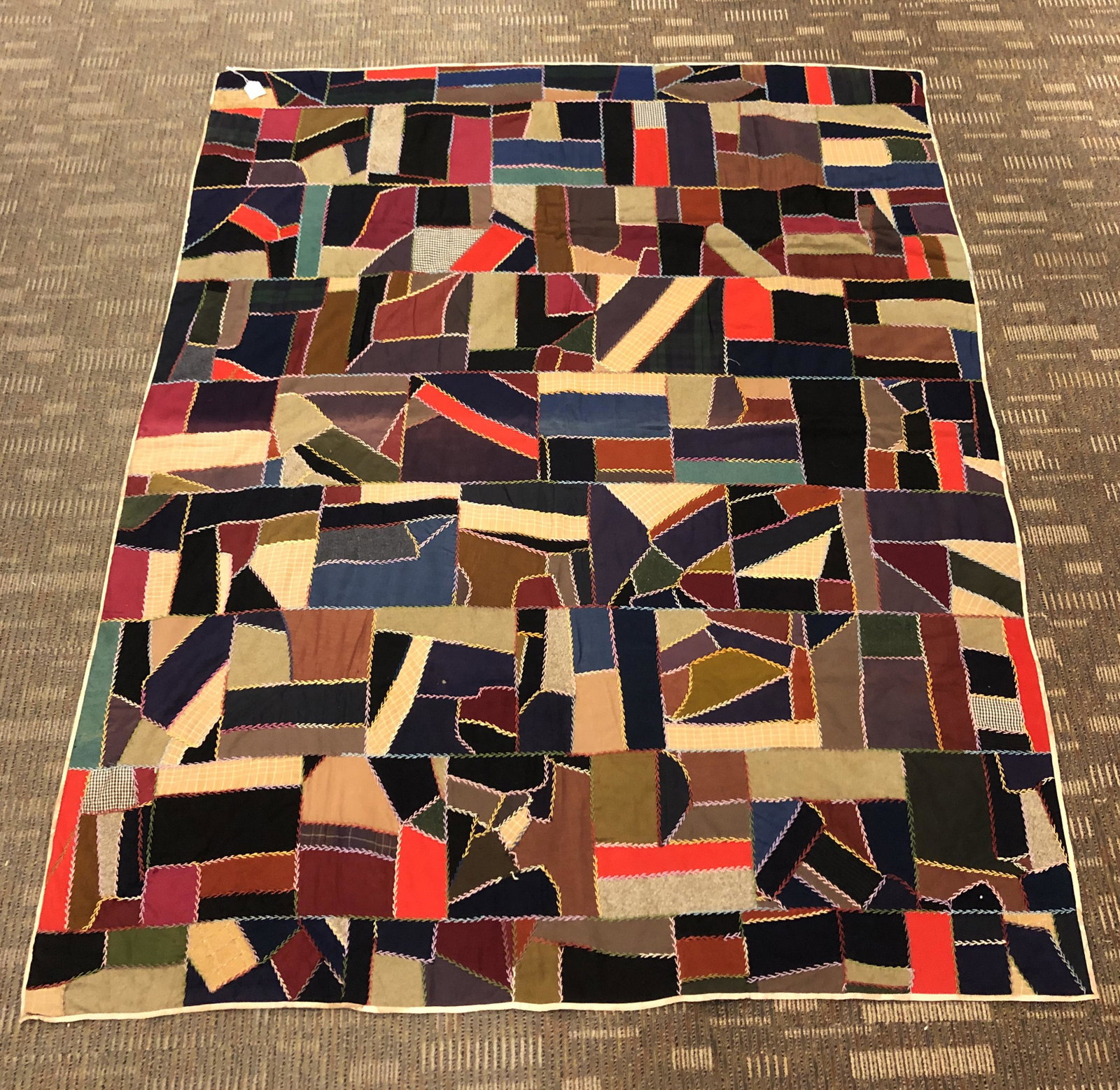 1900s Crazy Quilt: A 1900's crazy quilt with floral backing in very nice condition, it measures 6' X 5'.