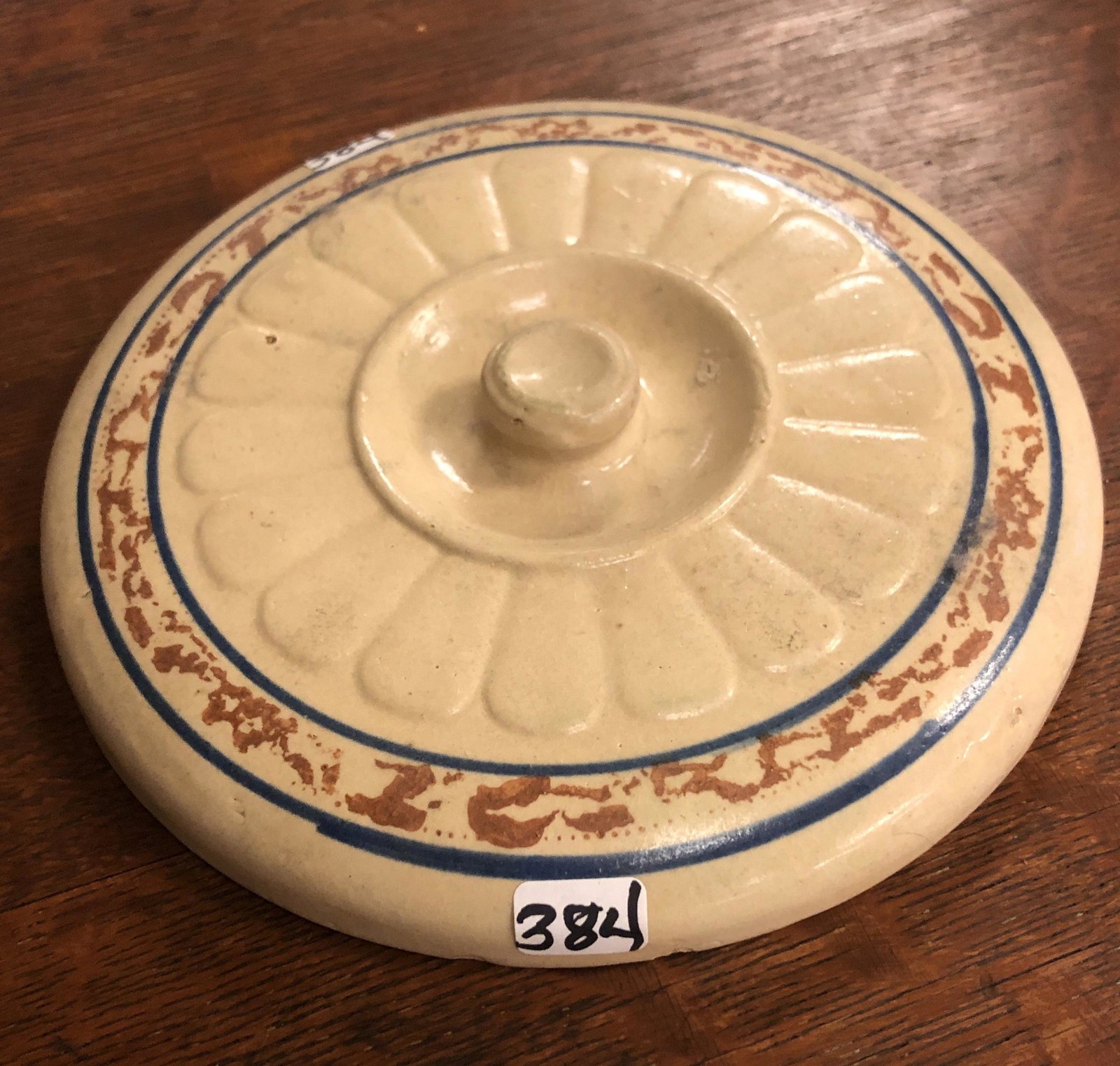 Redwing Spongeware Banded and Panel Casserole Cover: A Red Wing spongeware banded and panel casserole cover that measures 7.5" across.