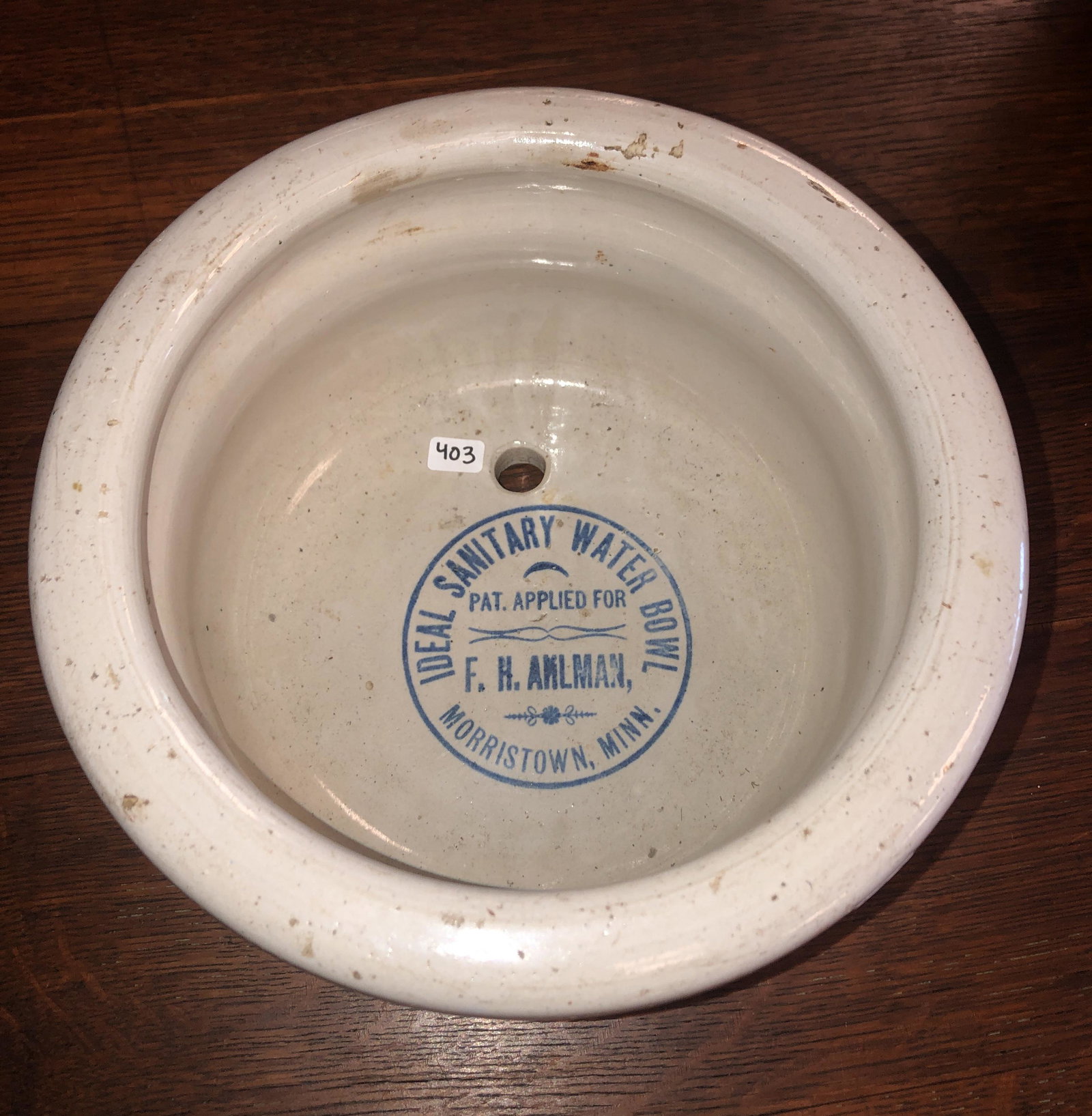 Stoneware Ideal Sanitary Water Bowl: A stoneware bowl that is stamped on inside "Ideal Sanitary Water Bowl Pat. Applied for F. H. Ahlman, Morristown, Minn." The bowl measures 5" tall X 10" across.