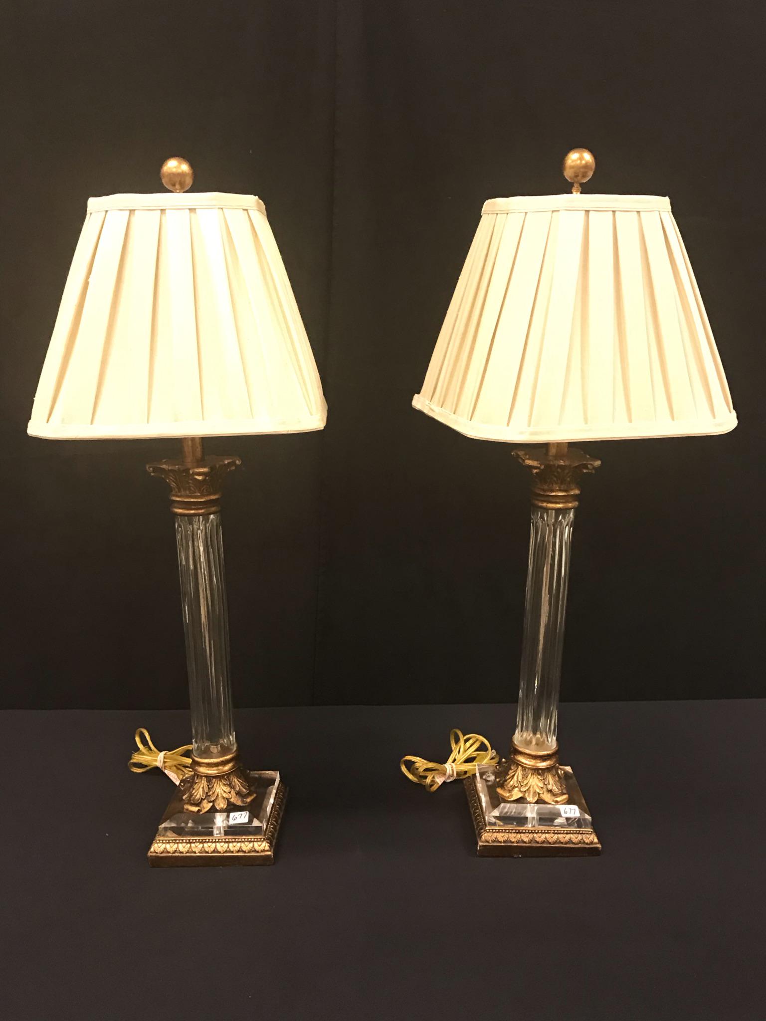 Matching Pair of Crystal and Glass Lamps: This pair of matching crystal Corinthian column lamps have pleated silk shades. They each measure 33" tall X 11" across.