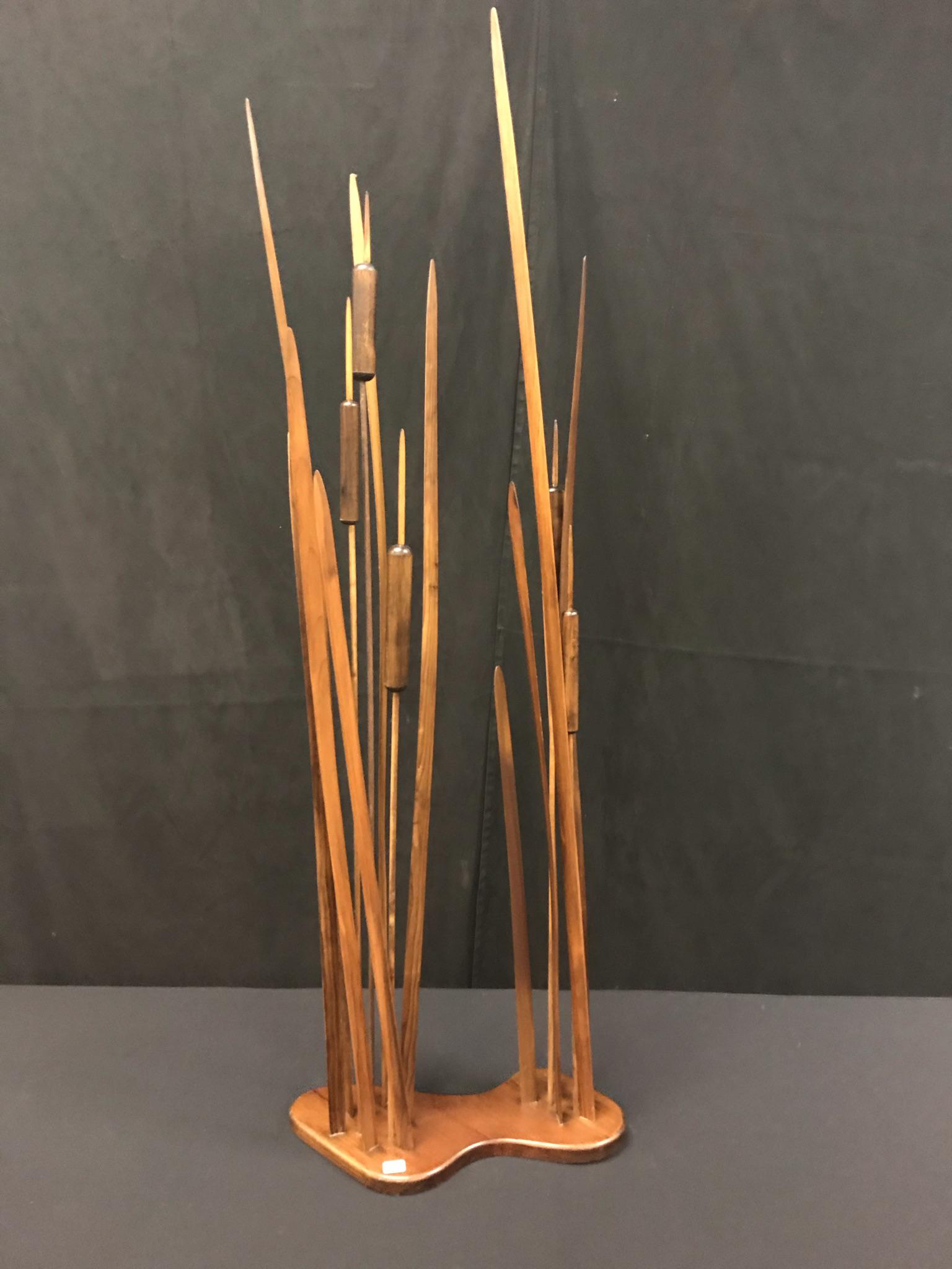 Jim Mann Folk Art Sculpture c. 1986: This signed handmade Folk Art wood cattail sculpture circa 1986 is by artist Jim Mann. It is signed by hand and dated on the bottom. It measures 47" tall X 14" across.