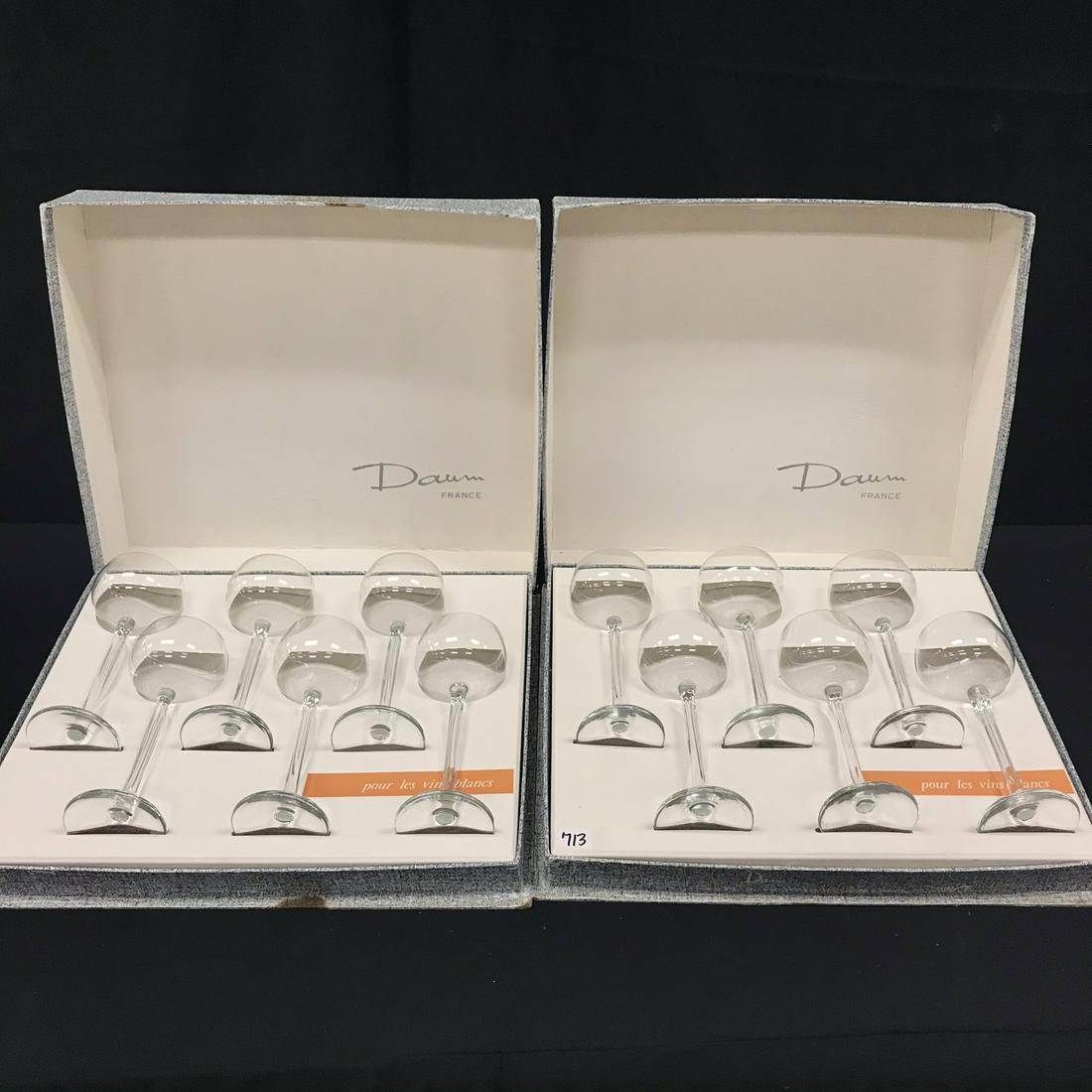 MCM Set of 12 Daum Wine Glasses: This set of 1950's Daum Nancy wine glasses in their original boxes are in excellent condition. The glasses are each signed on the bottom. The stems have a wavy design. They each meausure7.5" tall X 2.