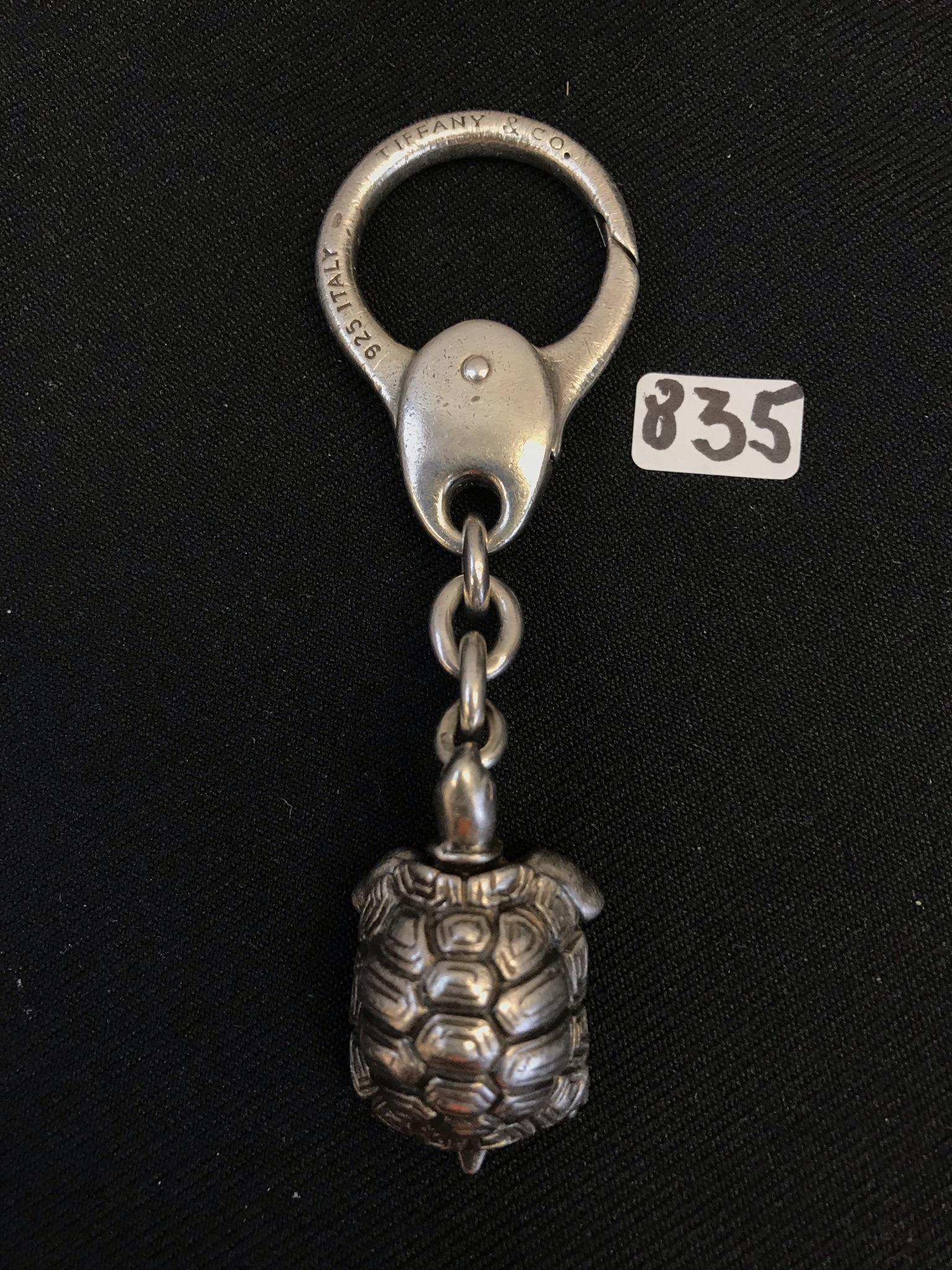 Tiffany Sterling Turtle Keychain: This sterling silver turtle keychain is by Tiffany &Co.. It measures 4" long X 1.25" across. It weighs 44.5 grams.