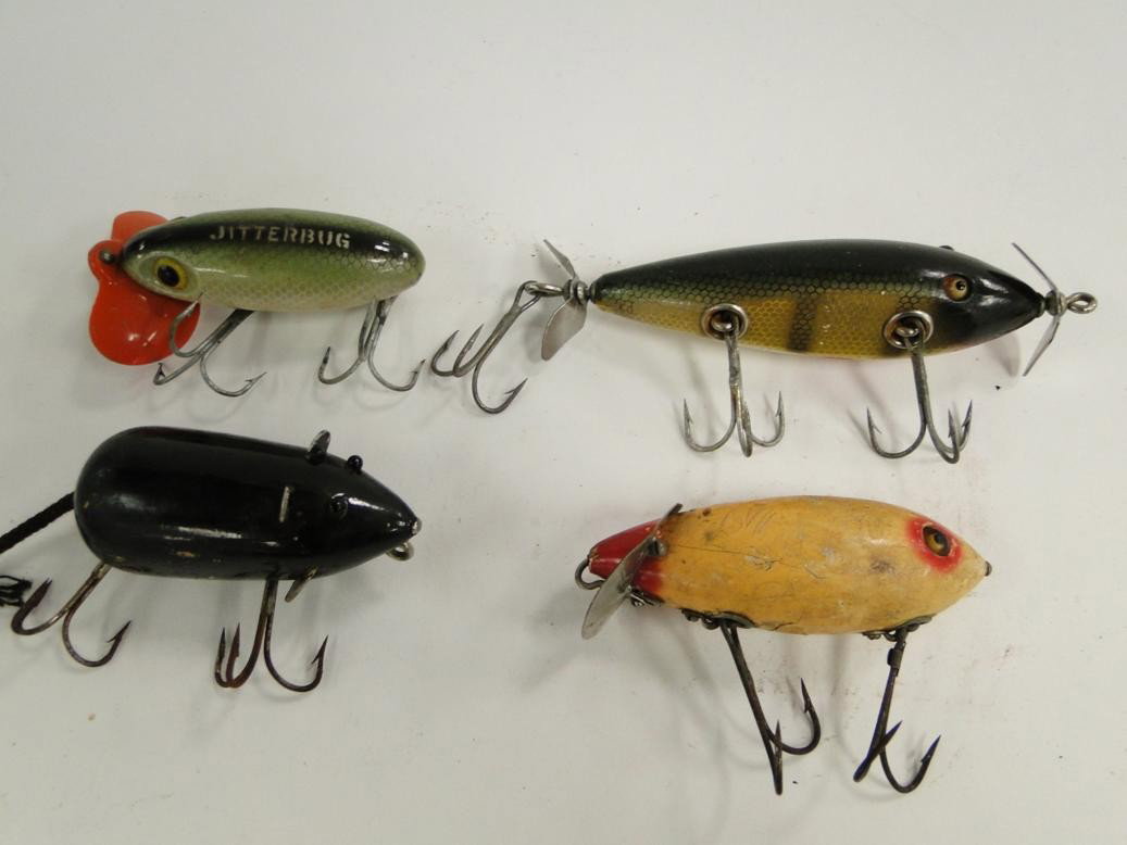 Group of four fishing lures to include: Jitterbug : Group of four fishing lures to include: Jitterbug by Fred Arbogast from Ohio, a wooden mouse, hand painted spinner with glass eyes, Heddons Wagiac crab wiggler