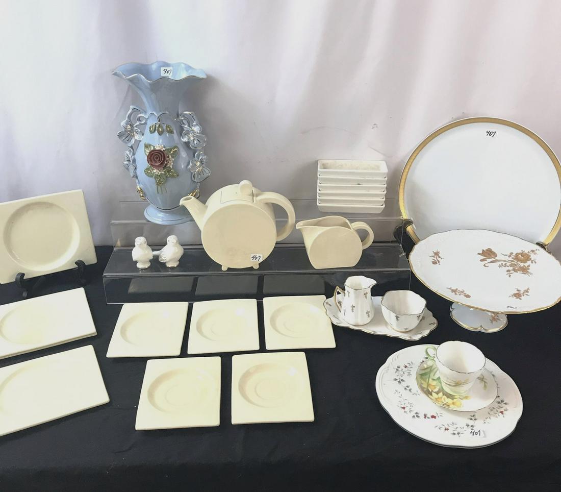 Art Deco Teapot, Bernardaud Limoges Plate and More: This lot includes an art deco tea pot, creamer, saucers and plates by Royal Staffordshire, a Bernardaud Limoges large plate new in its box, a Limoges pedestal platter and more.