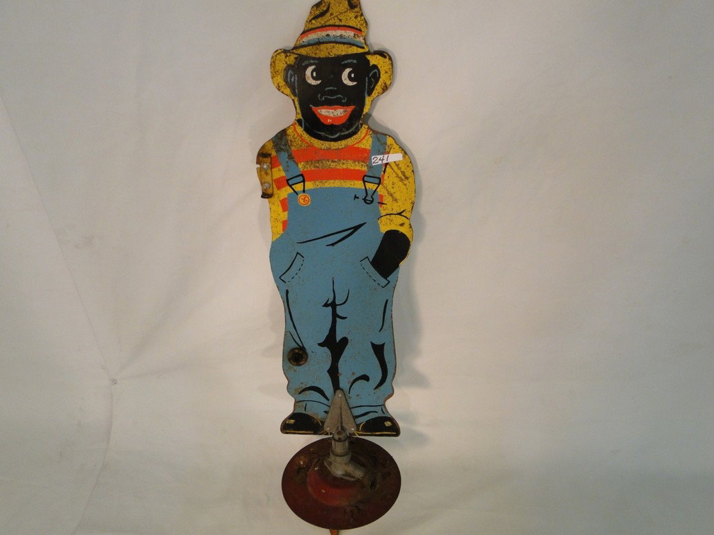 Black Americana Folk Art water sprinkler with grea: Black Americana Folk Art water sprinkler with great graphics - missing an arm