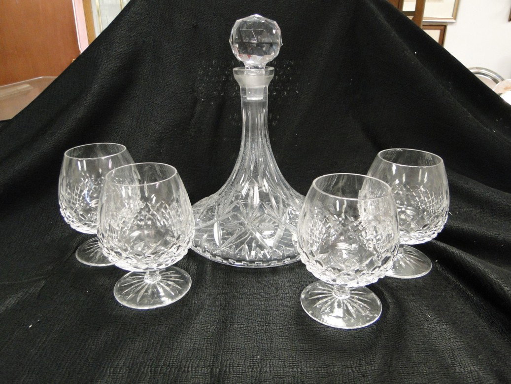 A set of Diamond cut crystal brandy sniffers signe: A set of Diamond cut crystal brandy sniffers signed on base rogacka along with a cut crystal decanter with stopper Est. Value $80-90