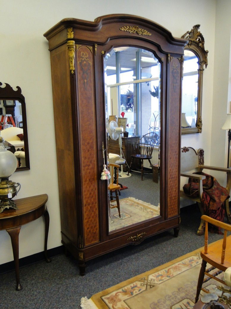 Outstanding French bronze floral Ormolu single-doo: Outstanding French bronze floral Ormolu single-door wardrobe with beveled glass full length mirror, floral ribbon and parquet inlays in Circassia mahogany. This outstanding, high-quality French wardro
