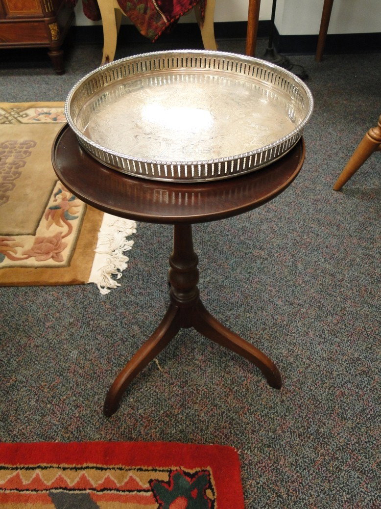Three legged mahogany side table with silver tray.: Three legged mahogany side table with silver tray. 24"H x 14"Dia. Est. value $50-60.