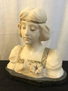 Marble Bust of Woman: A turn of the century marble bust on base of a woman with flower, headband and lace pattern collar. Bust has old gold paint highlighting details. Statue measures 10" across X 5.5" deep X 10.5" tall.