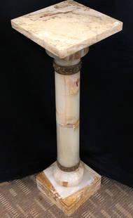 Victorian Onyx Pedestal Stand: A Victorian onyx pedestal plant stand with brass floral accents. Stand measures 39.5" tall X 11" across.