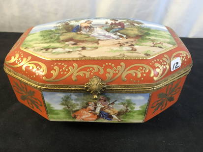 Handpainted Porcelain Sevres Style Jewelry Box: A late 19th century handpainted porcelain jewelry box. The box features a series of scenes depicting young lovers and is signed by the artist. This Sevres style piece is marked "JBH" on the bottom. Bo