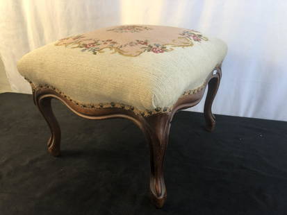 Oversized Victorian Needlepoint Foot Stool: An oversized floral Victorian needle and pettipoint foot stool. This quailty piece measures 14" tall X 18" X 18".