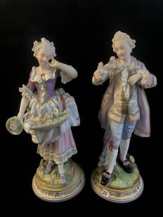 Pair of Oversized Bisque Statues: A pair of oversized Perrian French style figural statues of a man and a woman court figures. These professionally painted pieces date to the 1880s-90s and measure roughly 15.5" tall.