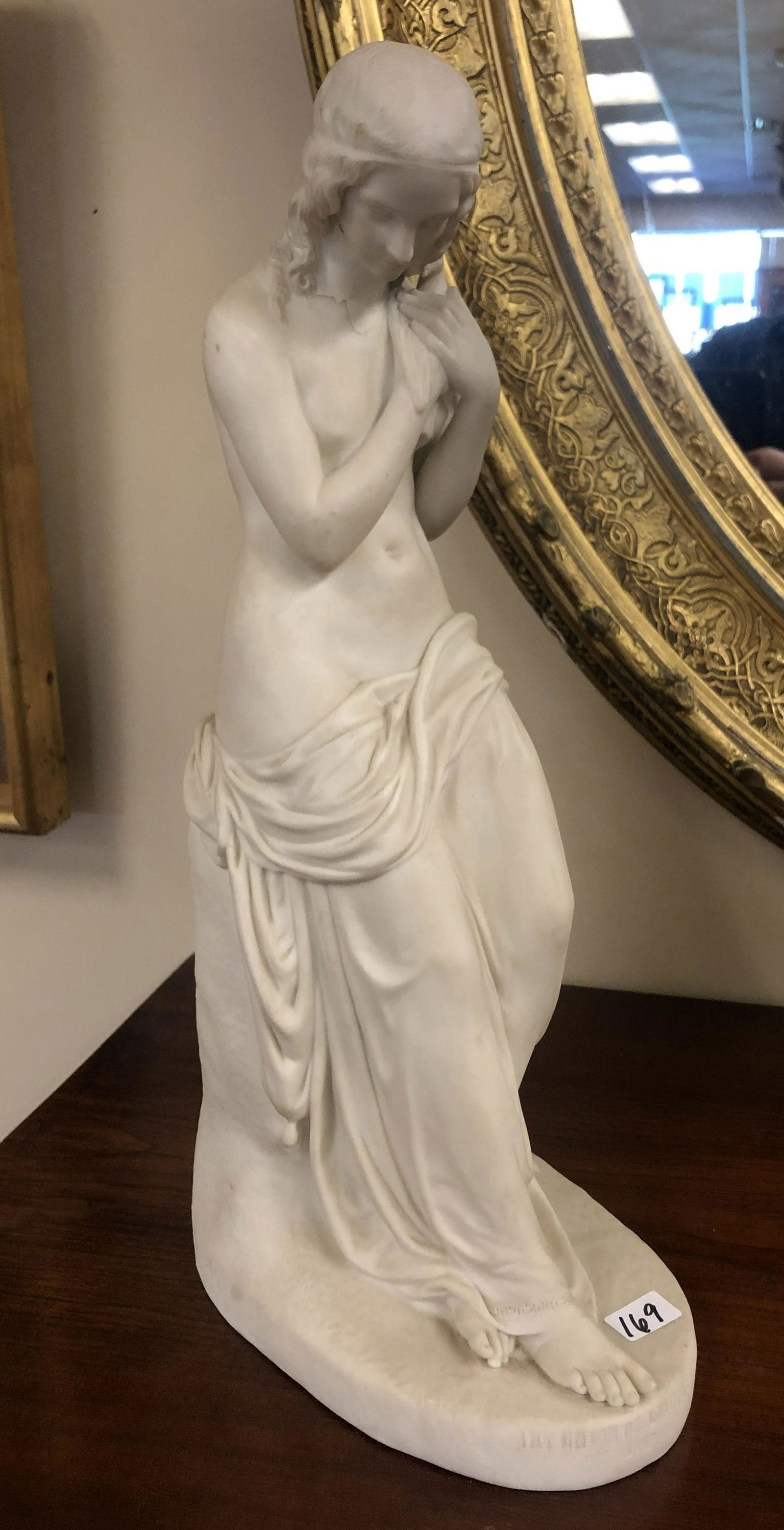 1847 J H Foley Parian Statue of Innocence: This Parian 1847 English statue is by noted English artist John Henry Foley. It was made by Copeland in Stokes on Trent for the Art Union Of London. It depicts a semi nude woman with a dove clutched t