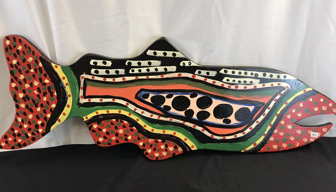 Jose Neives Folk Art Fish: This signed Folk Art wood fish is by listed artist Jose Nieves. It is brightly painted with circular patterns and signed on the lower edge, and meant to be hung on a wall. It measures 15" tall X 41" a