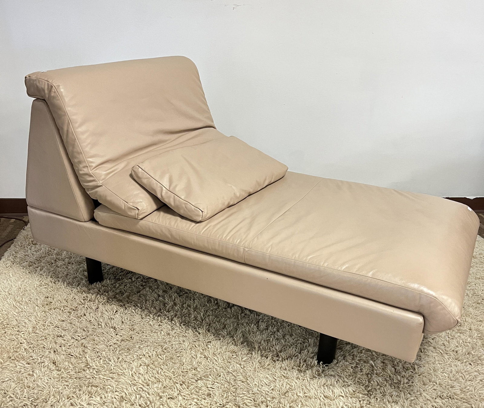Kron Modernist Leather Chaise Lounge: This Modernist Leather chaise lounge is by Kron furniture of Spain. It also includes a matching pillow. It measures 34" tall X 63" deep X 33" across the foot.