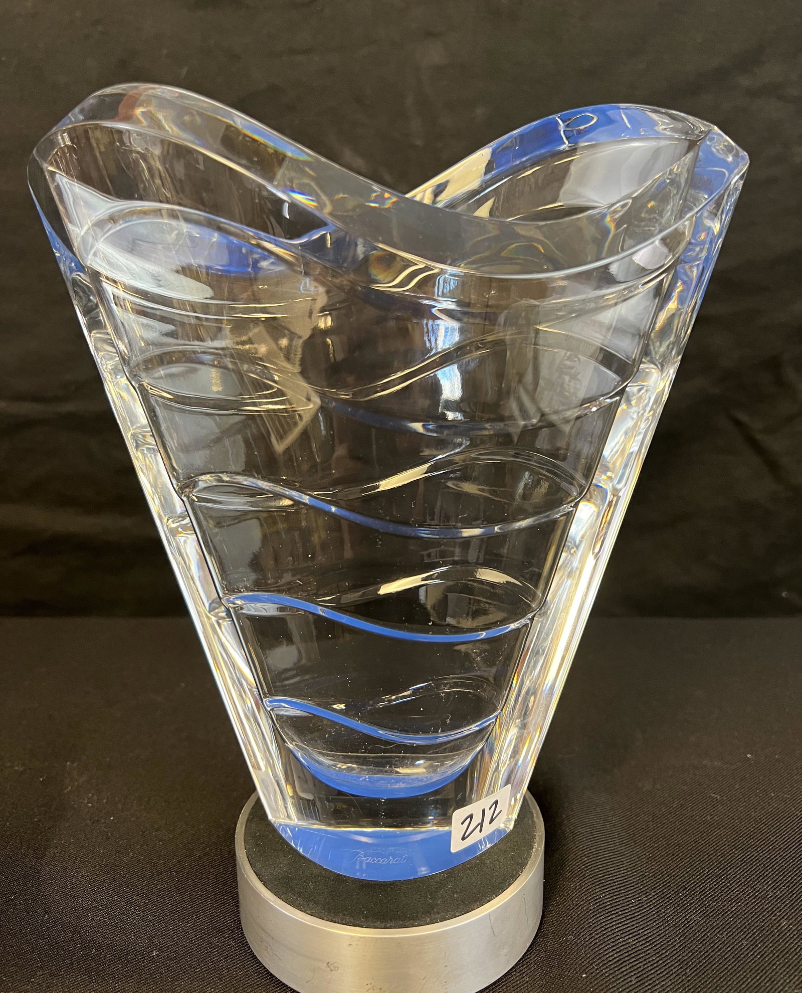 Baccarat Modernist Vase: This Modernist Crystal vase has a wave pattern and the Baccarat mark on the bottom. It measures 9" tall X 8" across X 4" deep.