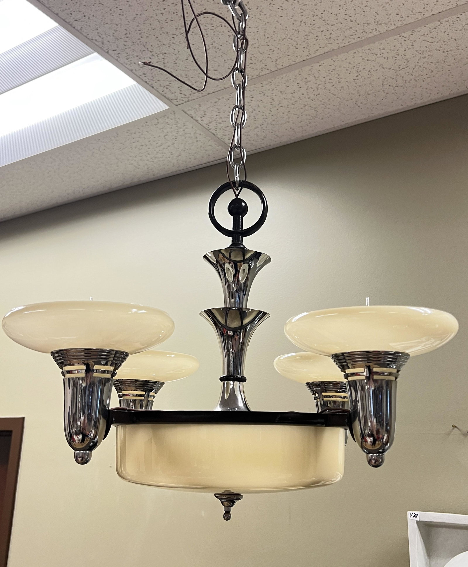 Four-Armed Chrome and Glass Hanging Chandelier: A four-armed chrome and glass hanging chandelier.