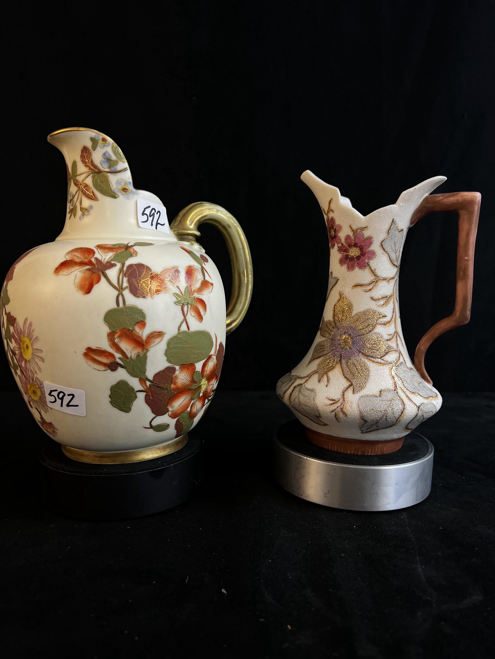 Early Royal Worcester Creamers, Pair, Crown Mark: A pair of early English Royal Worcester with crown mark creamers, one in a hand-painted Coraline, and the other with a floral hand painted design.